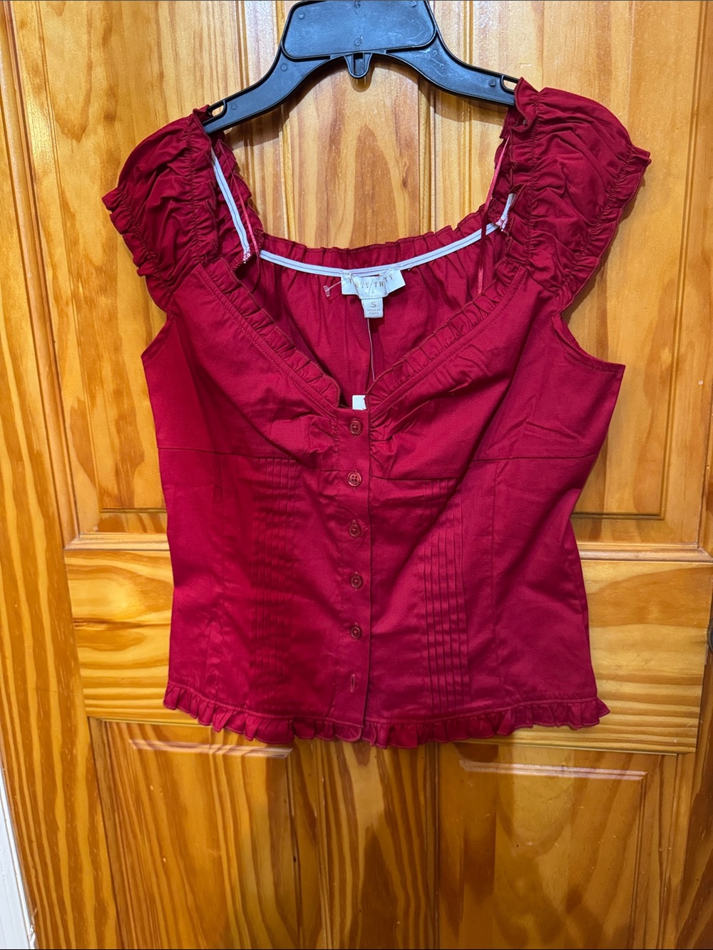 Sleeveless Ruffled Button-Front Blouse in Deep Red